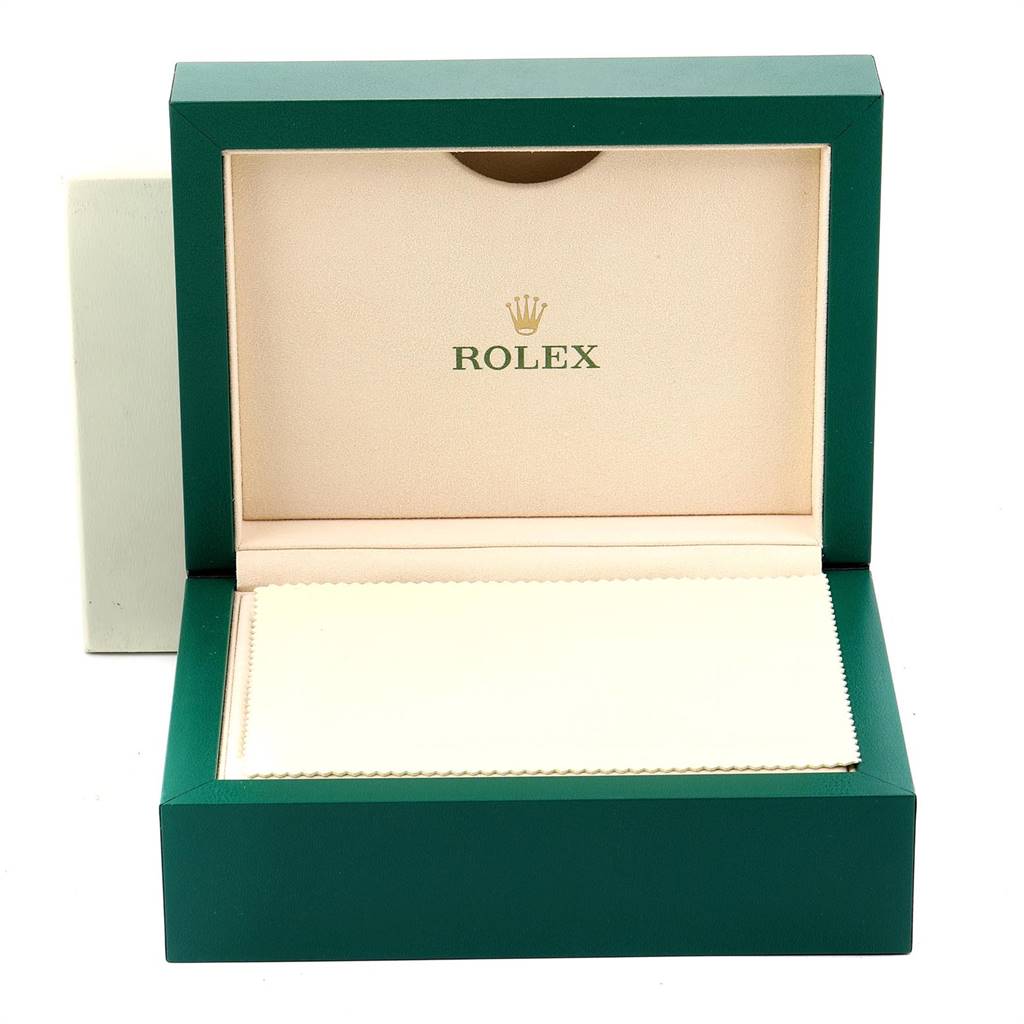 An open green Rolex watch box for the Yacht-Master model, showing the interior lining and logo.