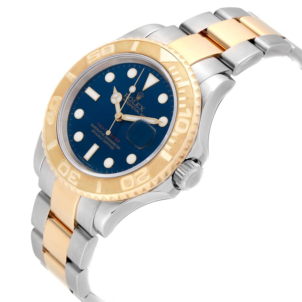 The image shows a Rolex Yacht-Master 16623 Men's Stainless Steel Blue Dial 16623 Men's Stainless Steel Blue Dial watch at a slight angle, highlighting its blue dial, gold bezel, and two-tone metal bracelet.