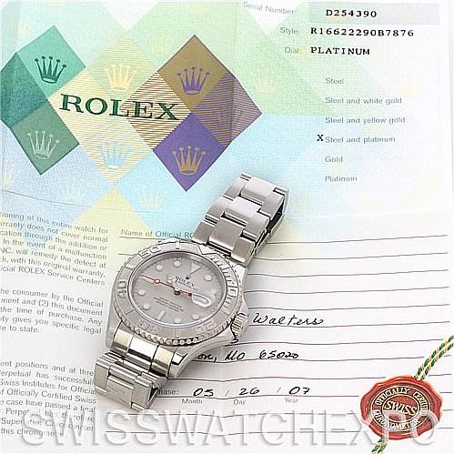 The image shows a Rolex Yacht-Master 16622 Men's Stainless Steel Silver Dial 16622 Men's Stainless Steel Silver Dial watch laid flat, displayed with its paperwork in the background.