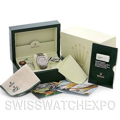 The image shows a Rolex Yacht-Master 16622 Men's Stainless Steel Silver Dial 16622 Men's Stainless Steel Silver Dial watch at an angle with its box, papers, cleaning cloth, and additional accessories.
