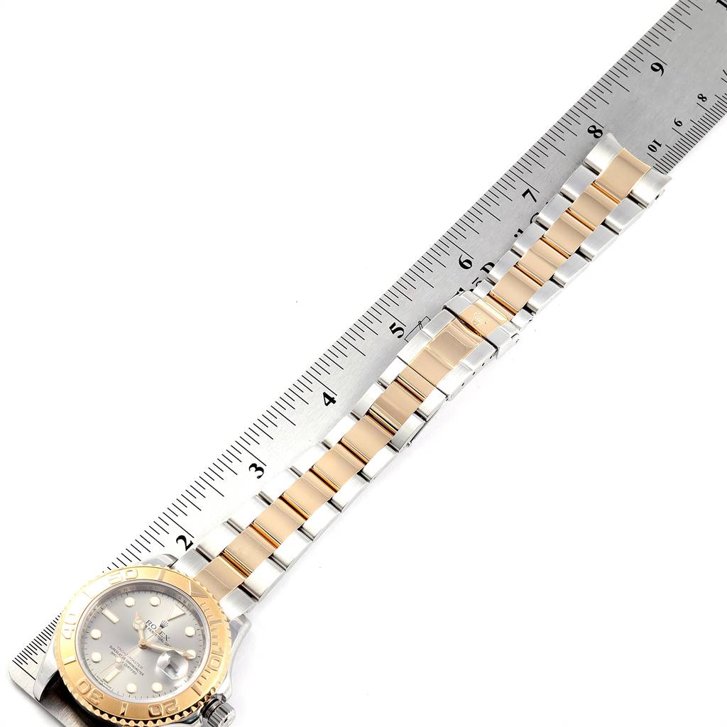 This image shows the entire Rolex Yacht-Master 16623 Men
s Stainless Steel Grey Dial 16623 Men
s Stainless Steel Grey Dial watch, with the watch band extended along a measuring ruler.