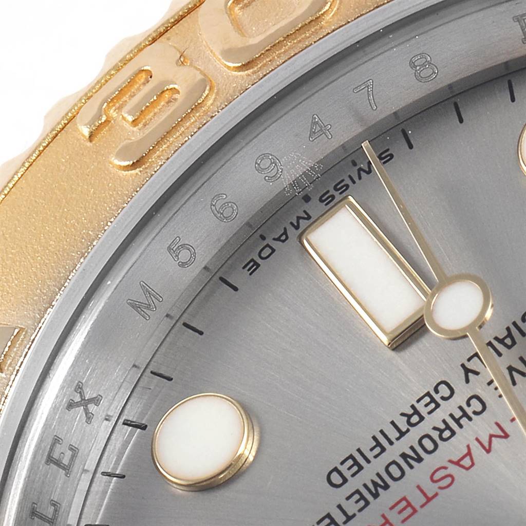 The image shows a close-up of the dial and bezel of a Rolex Yacht-Master 16623 Men
s Stainless Steel Grey Dial 16623 Men
s Stainless Steel Grey Dial watch, highlighting the Swiss Made text and part of the indices.