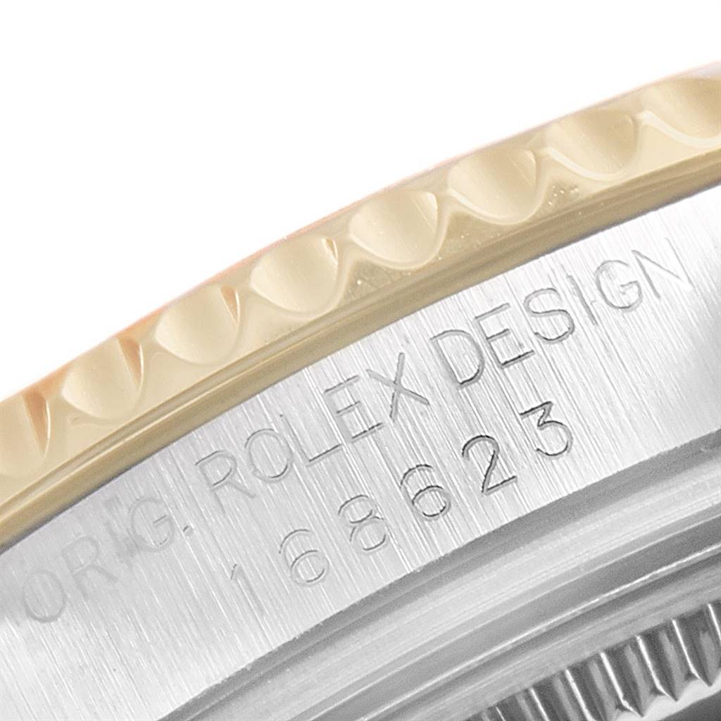 This close-up image shows the engraved side of the bezel of the Rolex Yacht-Master 168623 Men's Steel and Gold (two tone) White Dial 168623 Men's Steel and Gold (two tone) White Dial watch.