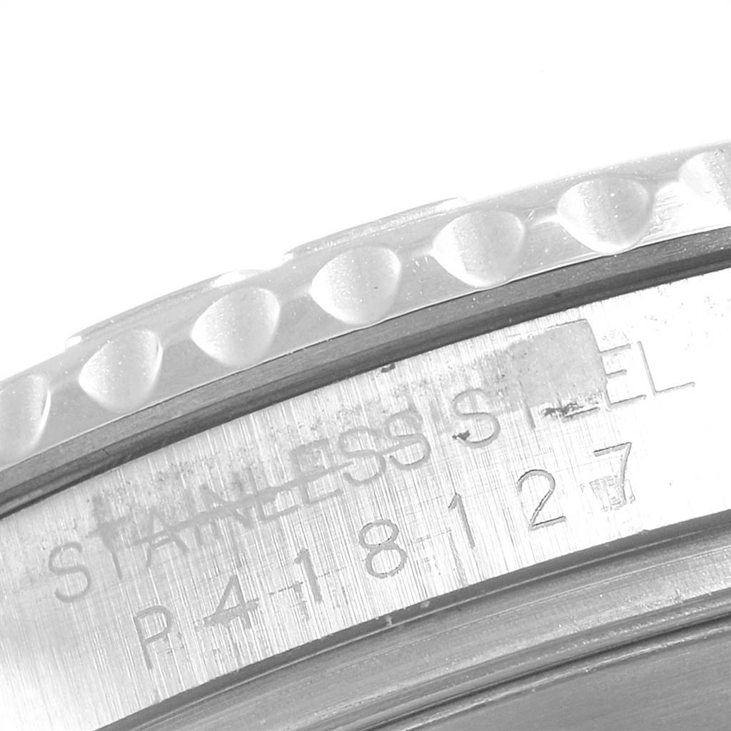 This image shows a close-up of the side of the bezel and the engraved serial number on a Rolex Yacht-Master 16622 Men
s Stainless Steel Silver Dial 16622 Men
s Stainless Steel Silver Dial watch.