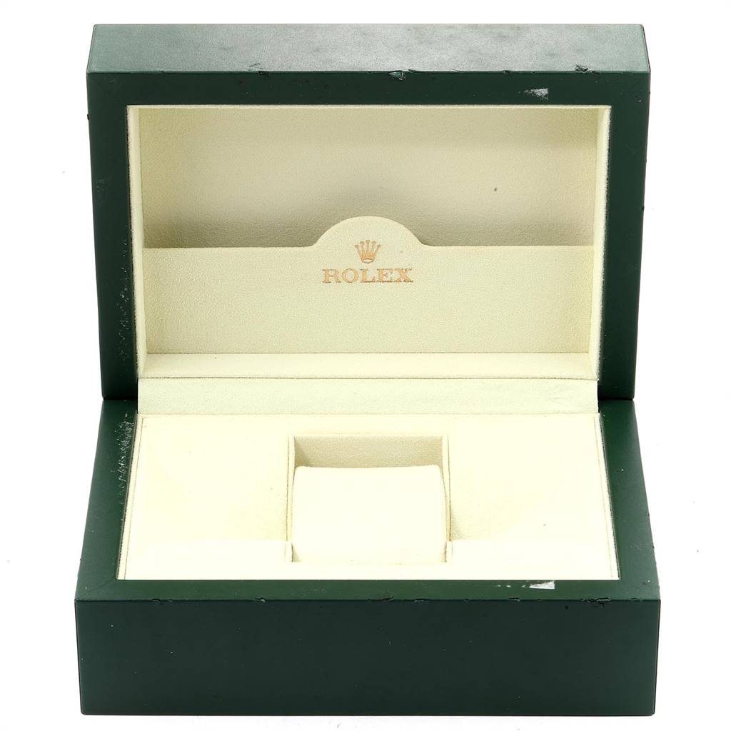 The image shows an open green Rolex box for the Yacht-Master model, displaying the beige interior and Rolex logo.