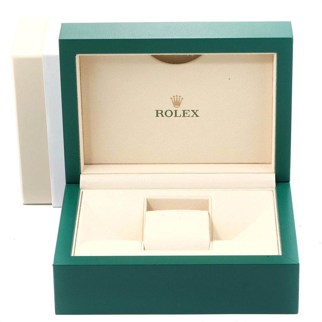 The image shows an open, empty Rolex box designed for the Yacht-Master model, featuring green and beige colors.
