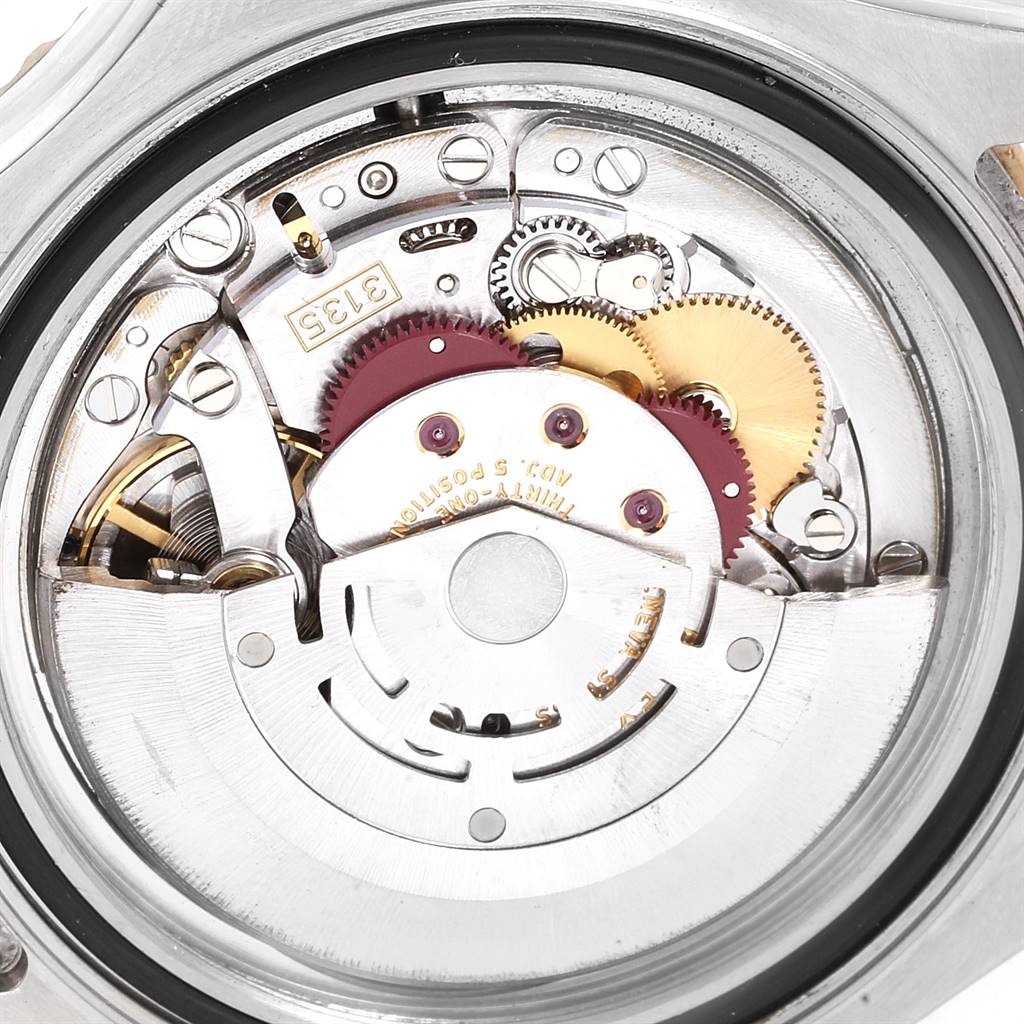 This image shows the intricate internal mechanism of the Rolex Yacht-Master 16623 Men's Stainless Steel Champagne Dial 16623 Men's Stainless Steel Champagne Dial watch from a close-up, top-down angle.