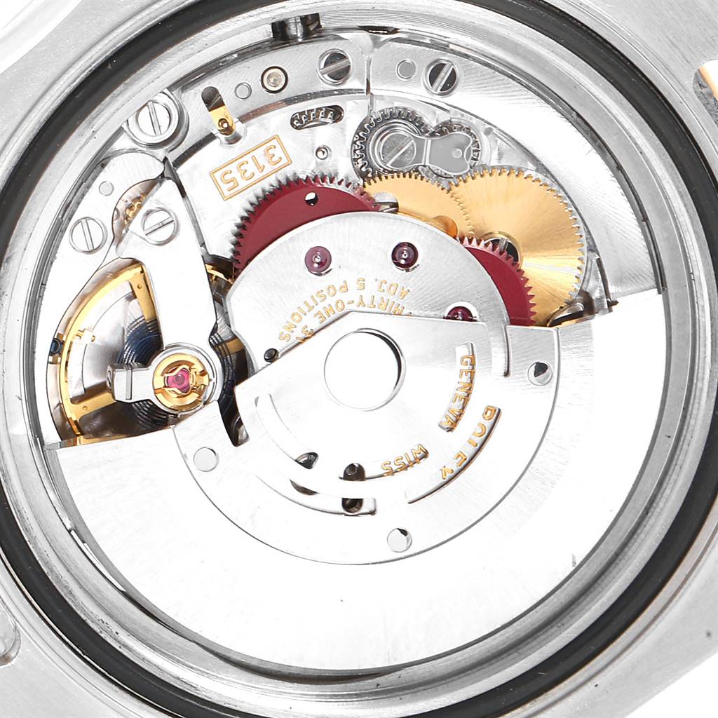 This is a close-up view of the internal movement of a Rolex Yacht-Master 16623 Men
s Stainless Steel White Dial 16623 Men
s Stainless Steel White Dial watch, showcasing its mechanical parts and gears.