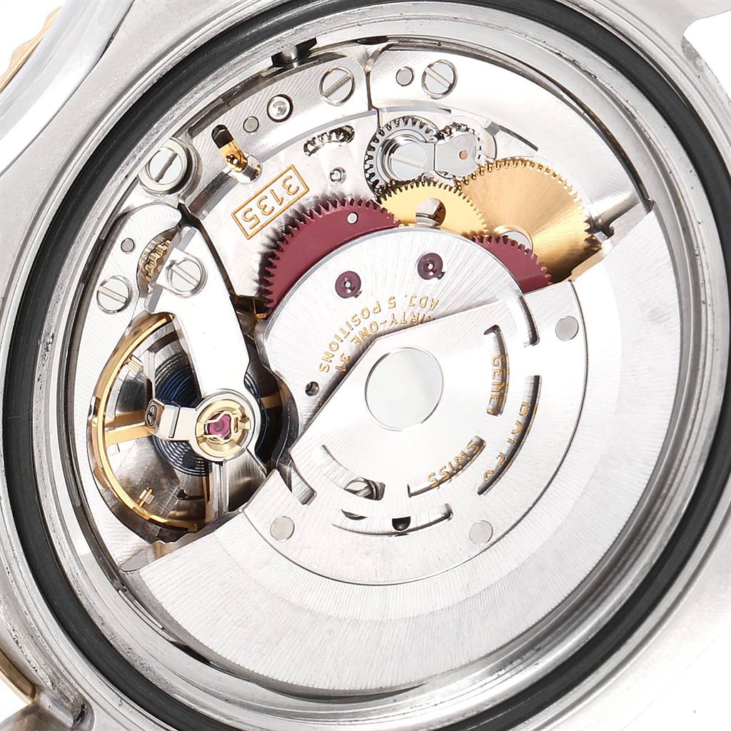 This close-up image shows the intricate internal mechanism of a Rolex Yacht-Master 16623 Men
s Stainless Steel White Dial 16623 Men
s Stainless Steel White Dial watch movement.