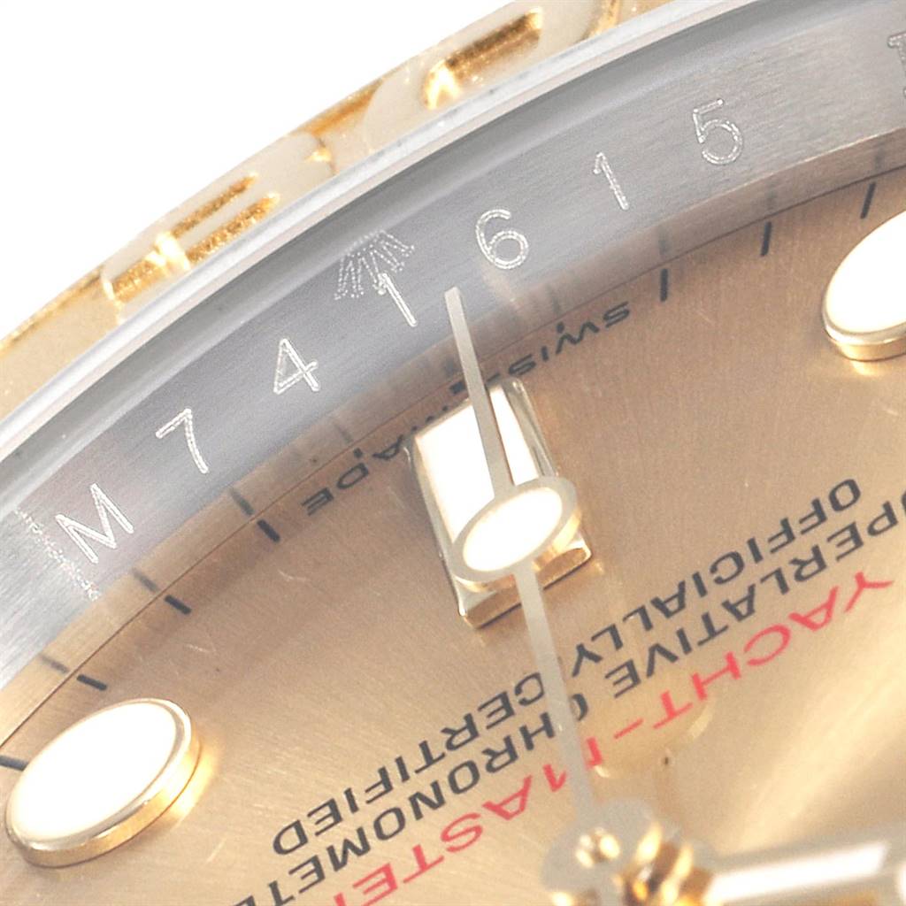 Close-up of the dial and a portion of the bezel of the Rolex Yacht-Master 16623 Men's Stainless Steel Champagne Dial 16623 Men's Stainless Steel Champagne Dial watch, showing part of the brand name and model name.