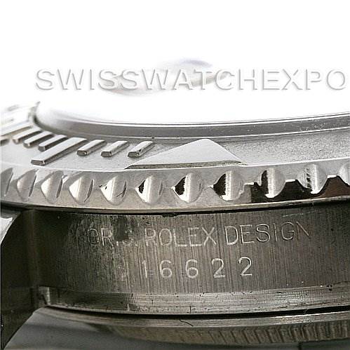 This close-up image of the Rolex Yacht-Master 16622 Men's Stainless Steel Silver Dial 16622 Men's Stainless Steel Silver Dial watch shows the stainless steel bezel and part of the case engraved with "Rolex Design 16622."