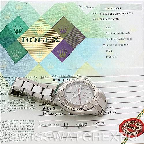 The image shows a Rolex Yacht-Master 16622 Men's Stainless Steel Silver Dial 16622 Men's Stainless Steel Silver Dial watch laid flat with its bracelet extended, and documents including the guarantee and certificate.