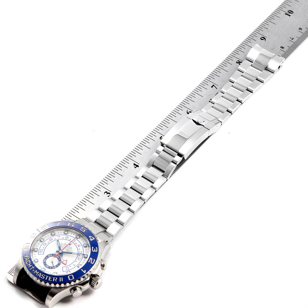 The image shows a Rolex Yacht-Master 116680 Men
s Stainless Steel White Dial 116680 Men
s Stainless Steel White Dial watch laid flat, displaying its bracelet along a ruler for measurement.