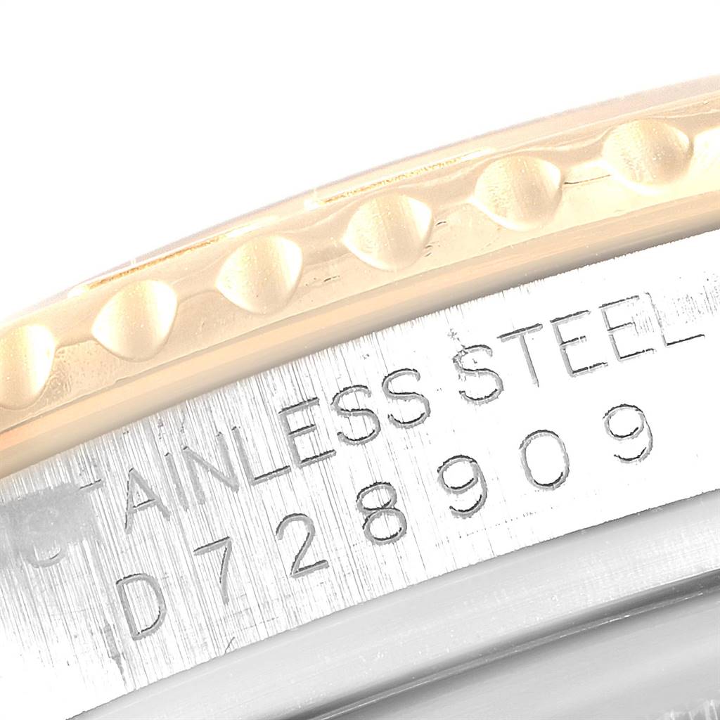 This close-up image shows the engraved stainless steel part and bezel detailing of a Rolex Yacht-Master 16623 Men's Stainless Steel Mother of Pearl Dial 16623 Men's Stainless Steel Mother of Pearl Dial watch.