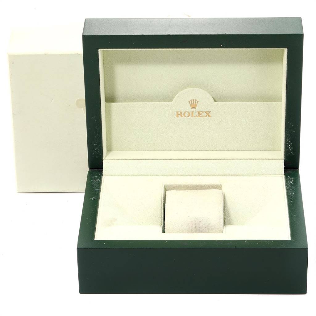 The image shows an open green Rolex watch box with an empty slot for the Yacht-Master model.