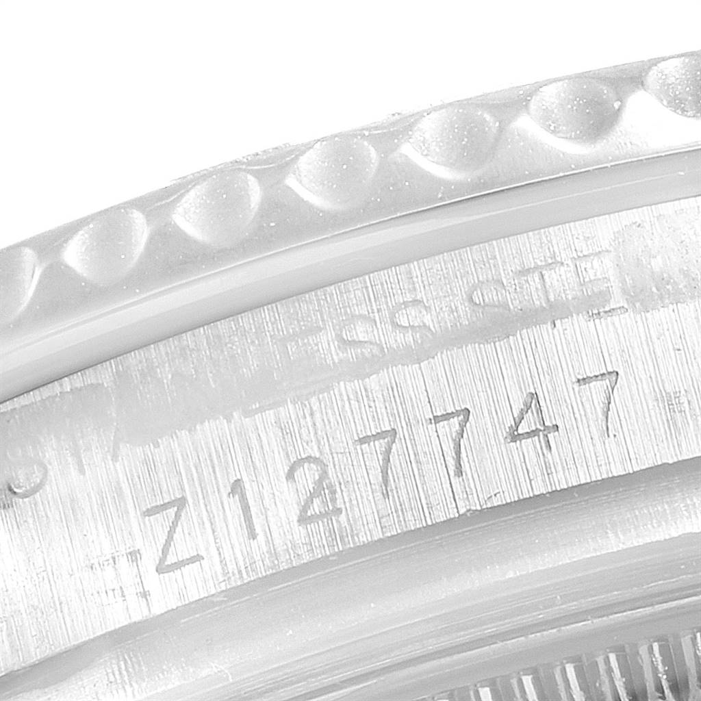 The image shows a close-up angle of the serial number engraved on the caseback of a Rolex Yacht-Master 168622 Men
s Stainless Steel Silver Dial 168622 Men
s Stainless Steel Silver Dial watch.