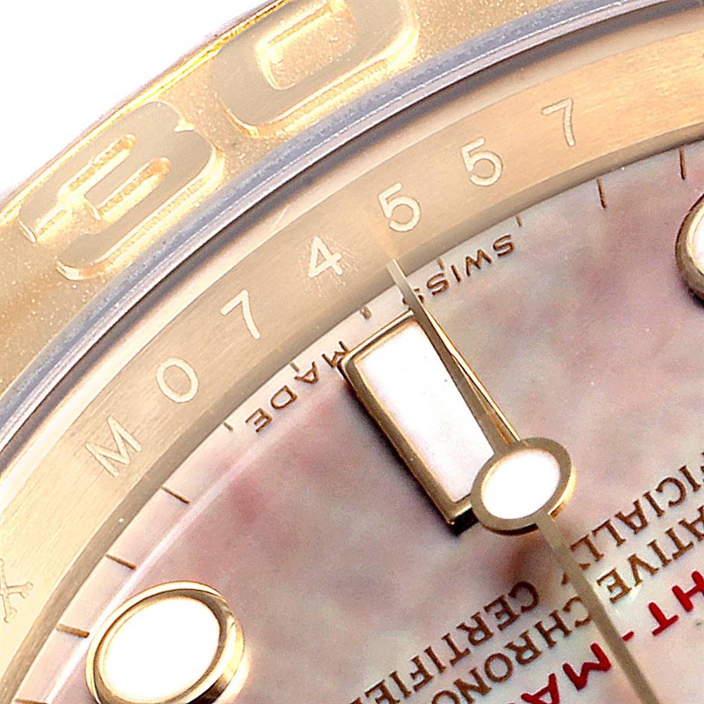 The image shows a close-up of the dial, bezel, and minute hand of a Rolex Yacht-Master 16628 Men's Yellow Gold Mother of Pearl Dial 16628 Men's Yellow Gold Mother of Pearl Dial watch.