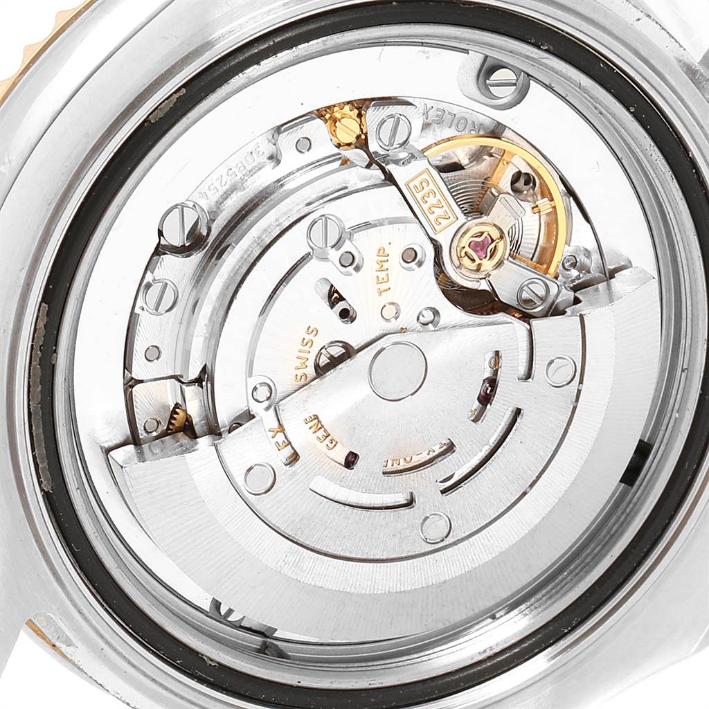 This image shows an up-close view of the movement mechanism inside a Rolex Yacht-Master 168623 Men's Steel and Gold (two tone) White Dial 168623 Men's Steel and Gold (two tone) White Dial watch.
