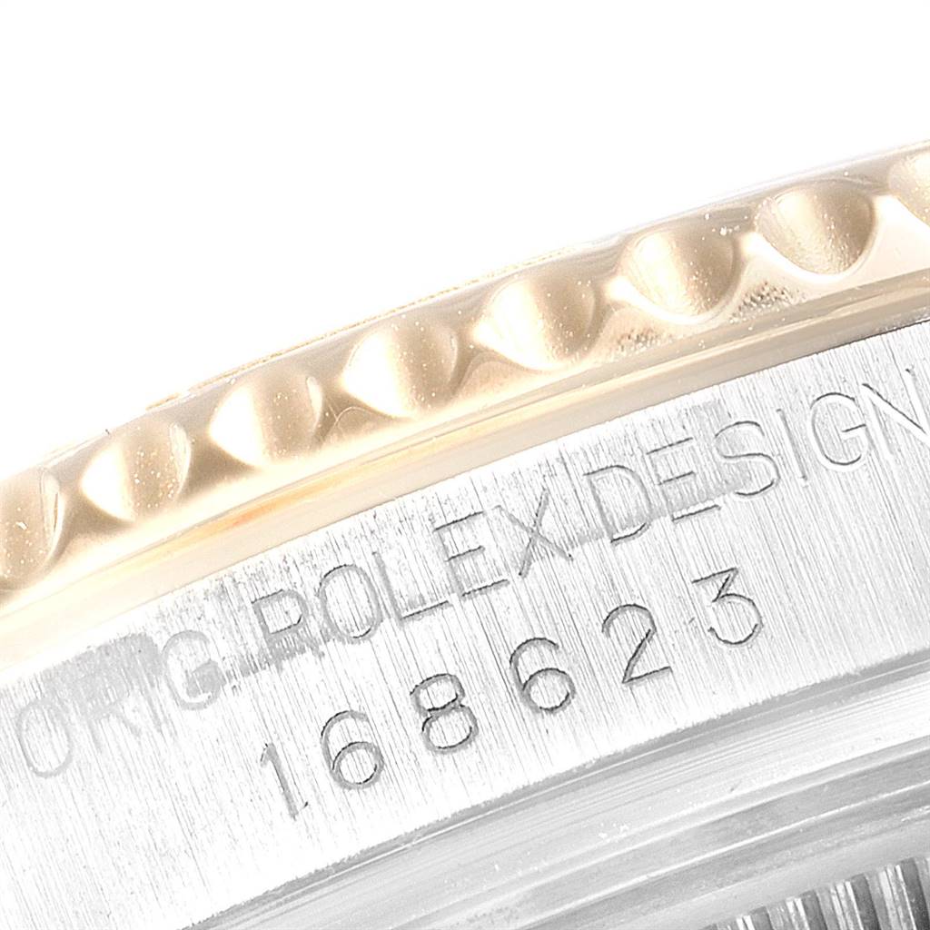 The image shows a close-up of the Yacht-Master Rolex watch, highlighting the engraved bezel and model number "168623."