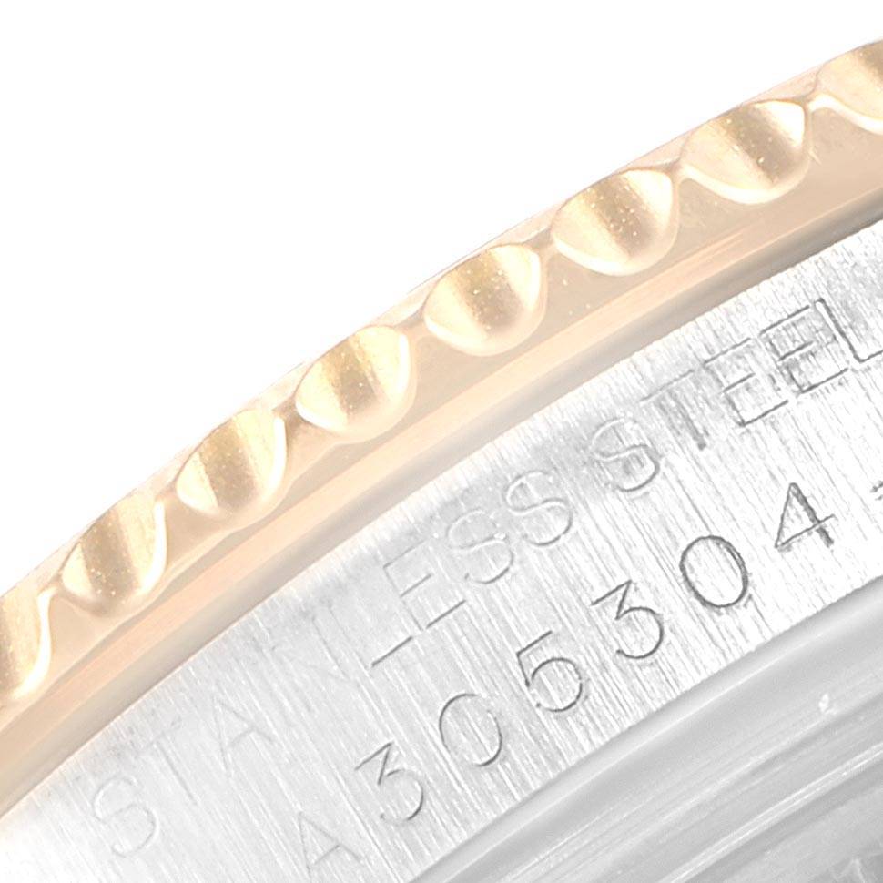 This image shows a close-up of the bezel and the engraved case back of a Rolex Yacht-Master 168623 Men
s Steel and Gold (two tone) Grey Dial 168623 Men
s Steel and Gold (two tone) Grey Dial watch.