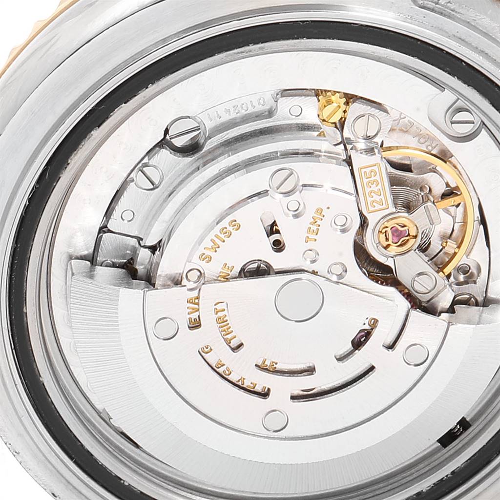 This image shows a close-up of the movement mechanism inside a Rolex Yacht-Master 168623 Men
s Steel and Gold (two tone) Grey Dial 168623 Men
s Steel and Gold (two tone) Grey Dial watch.