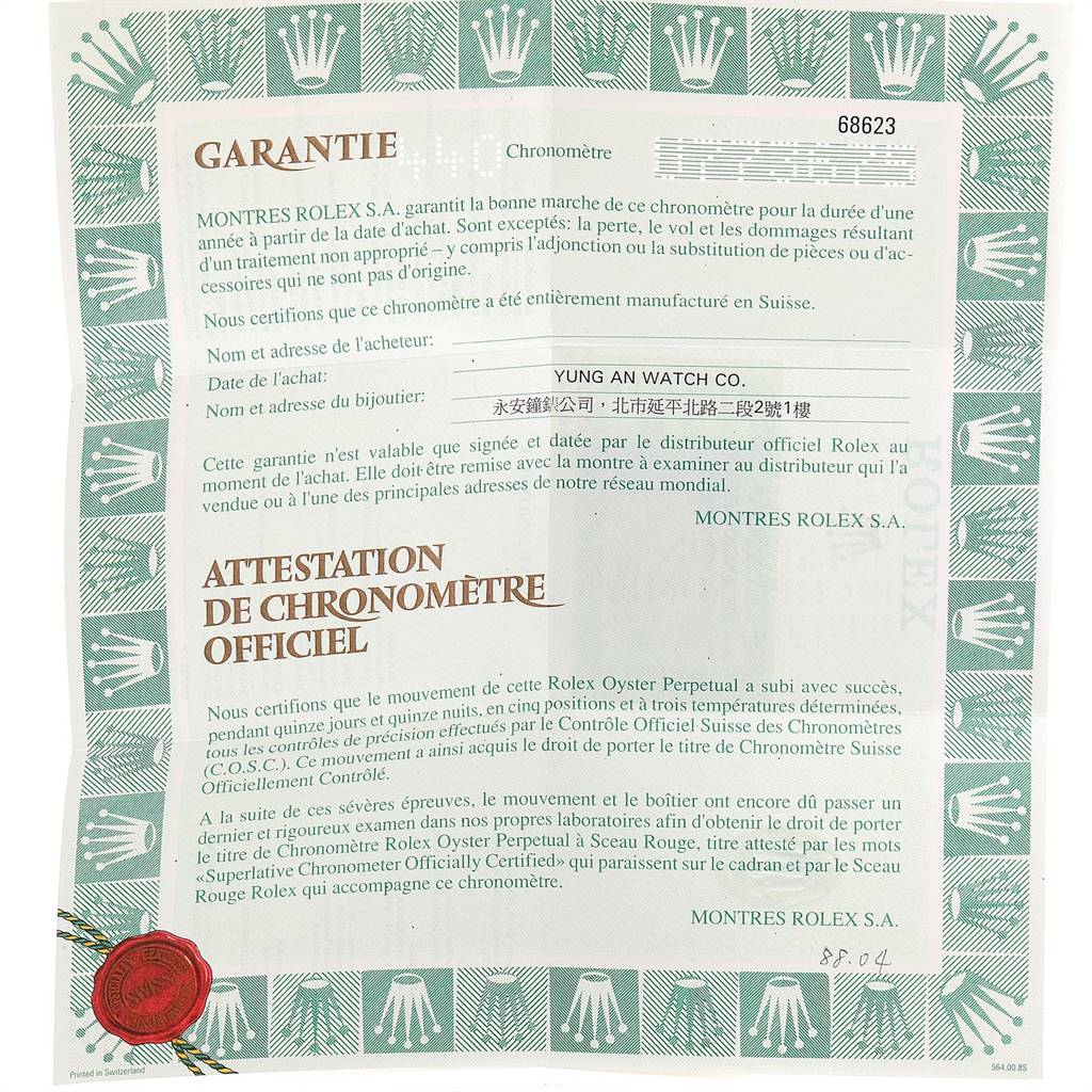 The image displays a warranty certificate for the Rolex Yacht-Master 68623 Men
s Steel and Gold (two tone) Grey Dial 68623 Men
s Steel and Gold (two tone) Grey Dial model, featuring text descriptions and official seals.