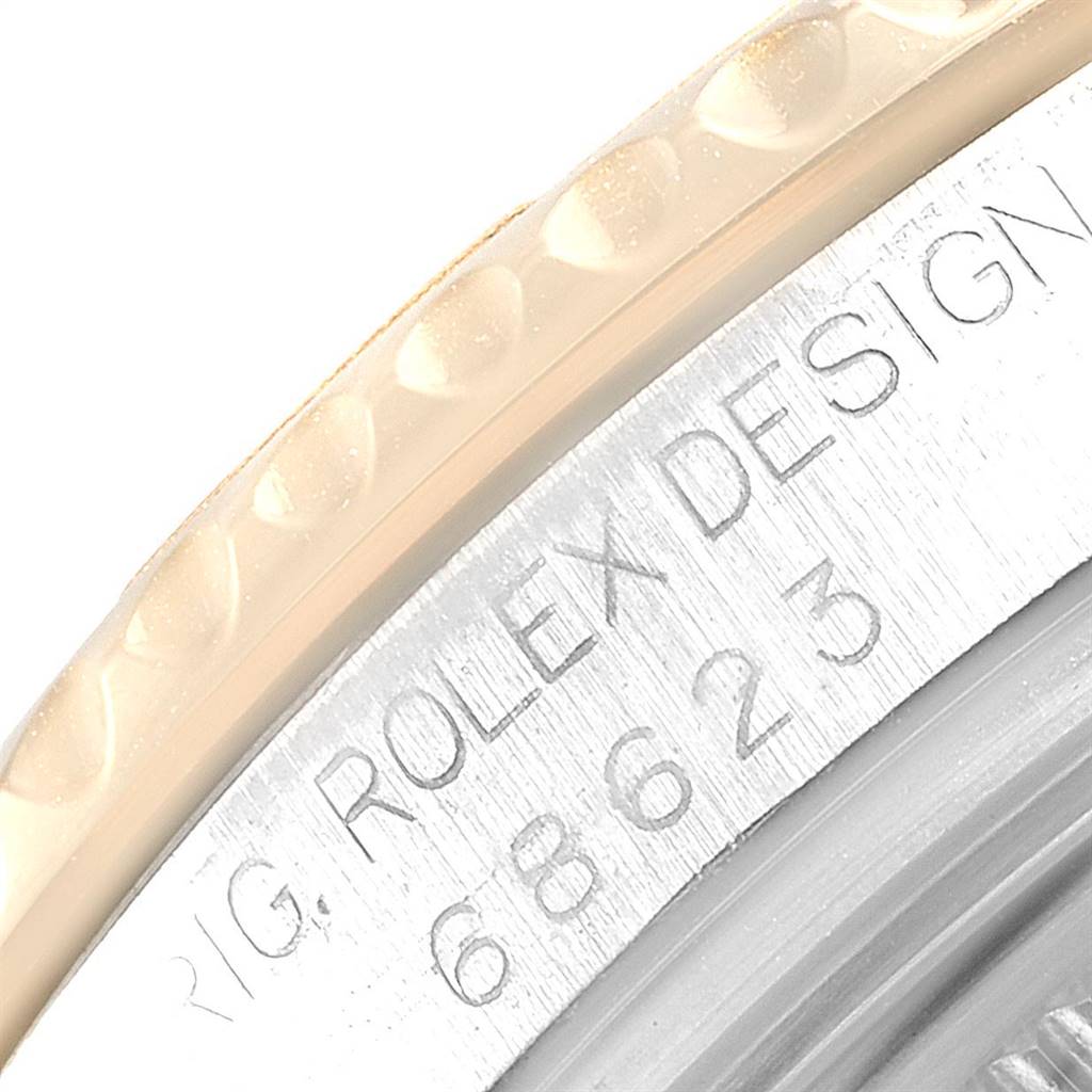 Close-up of the case side and bezel of a Rolex Yacht-Master 68623 Men
s Steel and Gold (two tone) Grey Dial 68623 Men
s Steel and Gold (two tone) Grey Dial, showing the model number and "ROLEX DESIGN" engraving.