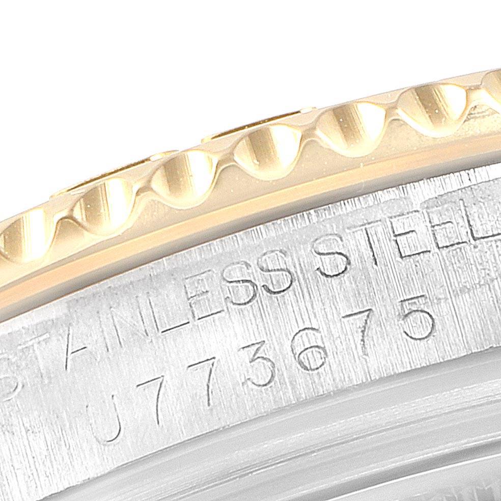 The image shows a close-up of the bezel and edge of the caseback of a Rolex Yacht-Master 68623 Men
s Steel and Gold (two tone) Grey Dial 68623 Men
s Steel and Gold (two tone) Grey Dial watch.