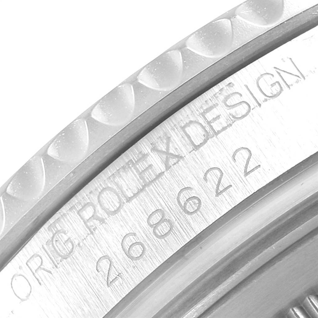 The image shows the side view of a Rolex Yacht-Master 268622 Men
s Stainless Steel Grey Dial 268622 Men
s Stainless Steel Grey Dial watch, highlighting the bezel and part of the engraved serial number.