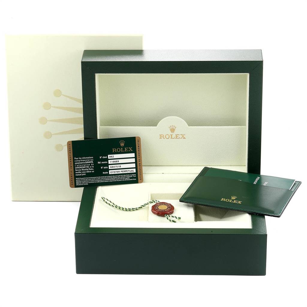 The image shows the box and accessories of a Rolex Yacht-Master 116689 Men's White Gold White Dial 116689 Men's White Gold White Dial, including the warranty card, booklet, and tag.