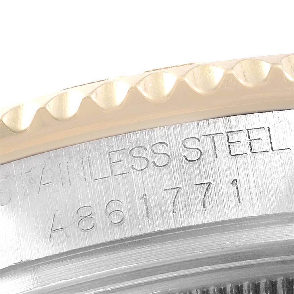 This image shows a close-up of the engraved stainless steel bezel of a Rolex Yacht-Master 168623 Men
s Steel and Gold (two tone) Grey Dial 168623 Men
s Steel and Gold (two tone) Grey Dial watch.