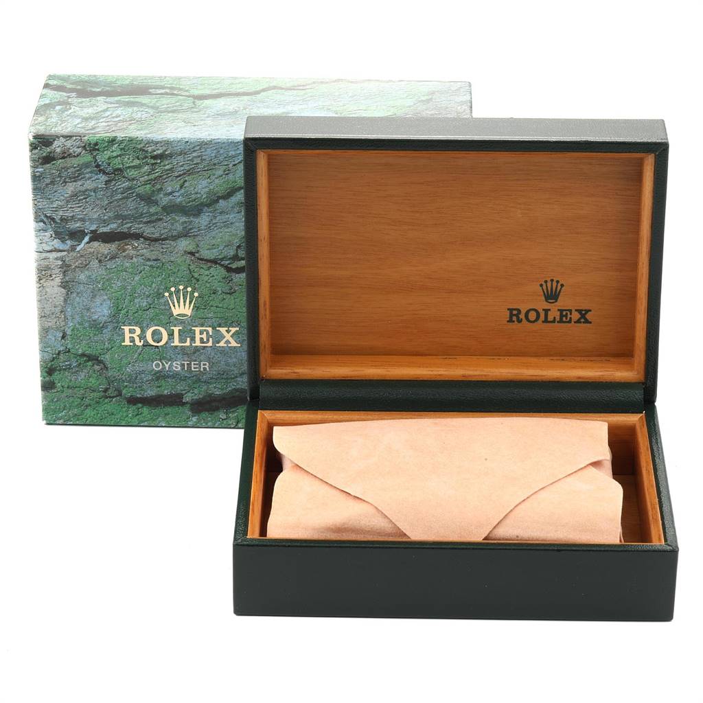 The image shows an open Rolex Yacht-Master 168623 Men
s Steel and Gold (two tone) Grey Dial 168623 Men
s Steel and Gold (two tone) Grey Dial watch box with a green outer box and a cushioned interior.