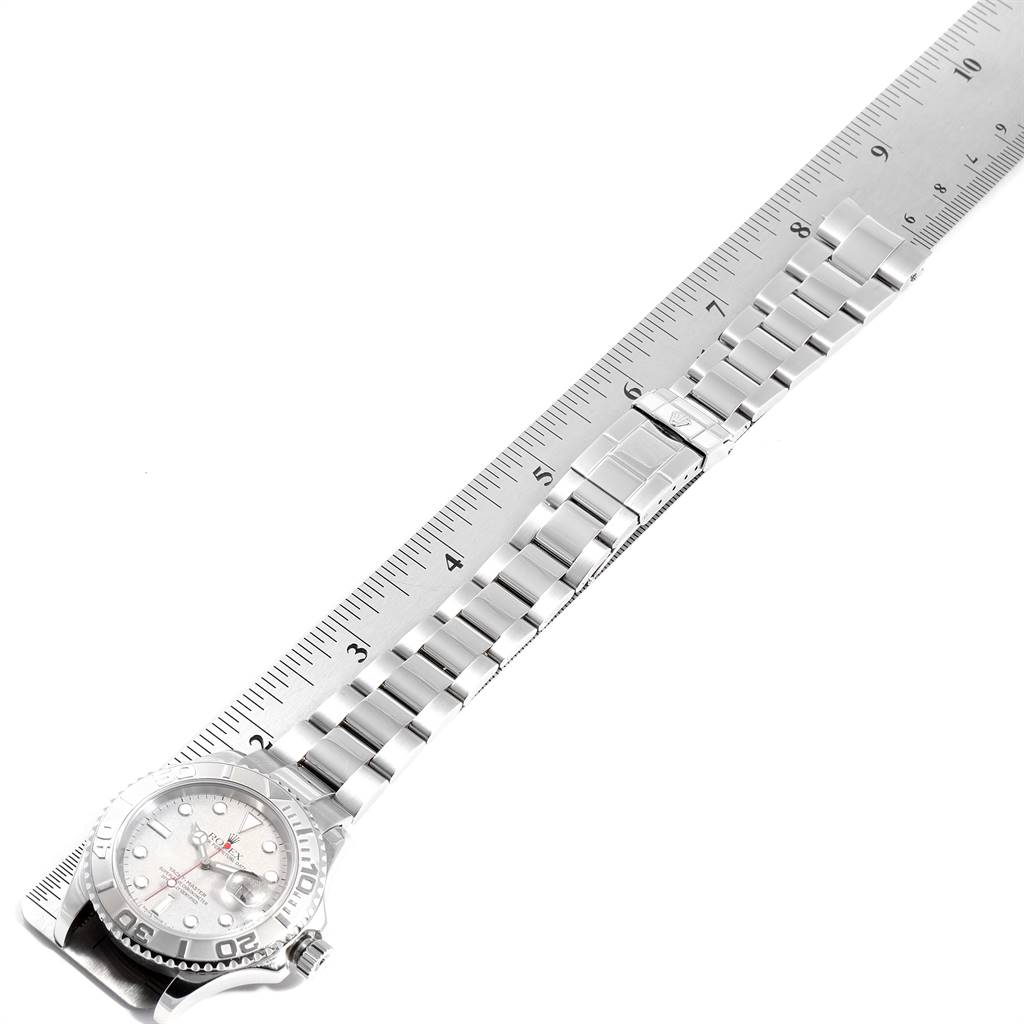 The image shows a Rolex Yacht-Master 16622 Men
s Stainless Steel Silver Dial 16622 Men
s Stainless Steel Silver Dial watch laid flat with its strap extended and measured against a ruler.