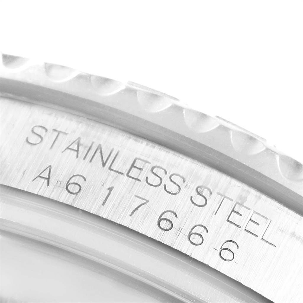 This close-up image shows the side engraving on the case of a Rolex Yacht-Master 16622 Men
s Stainless Steel Silver Dial 16622 Men
s Stainless Steel Silver Dial, emphasizing "STAINLESS STEEL" and a serial number.