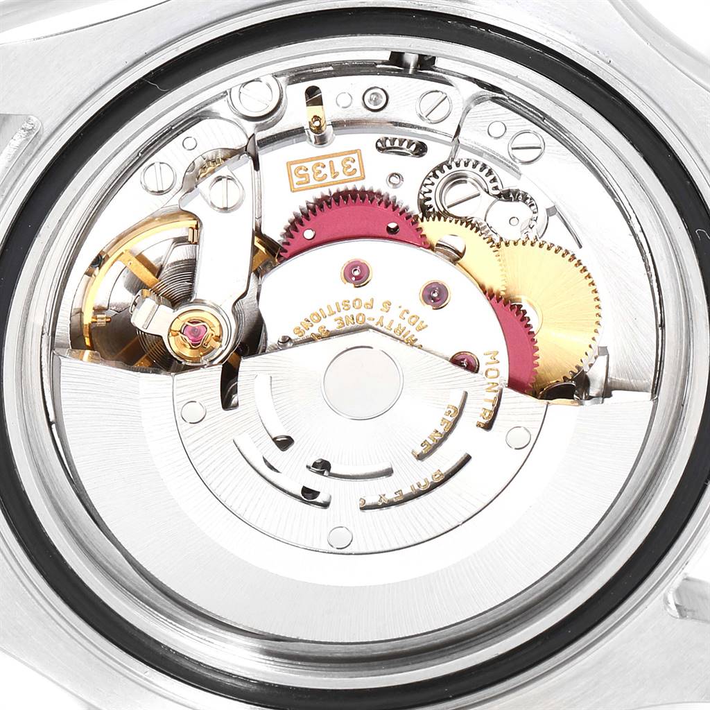 The image shows the internal mechanics of a Rolex Yacht-Master 16622 Men
s Stainless Steel Silver Dial 16622 Men
s Stainless Steel Silver Dial watch viewed from the back, highlighting its movement components.