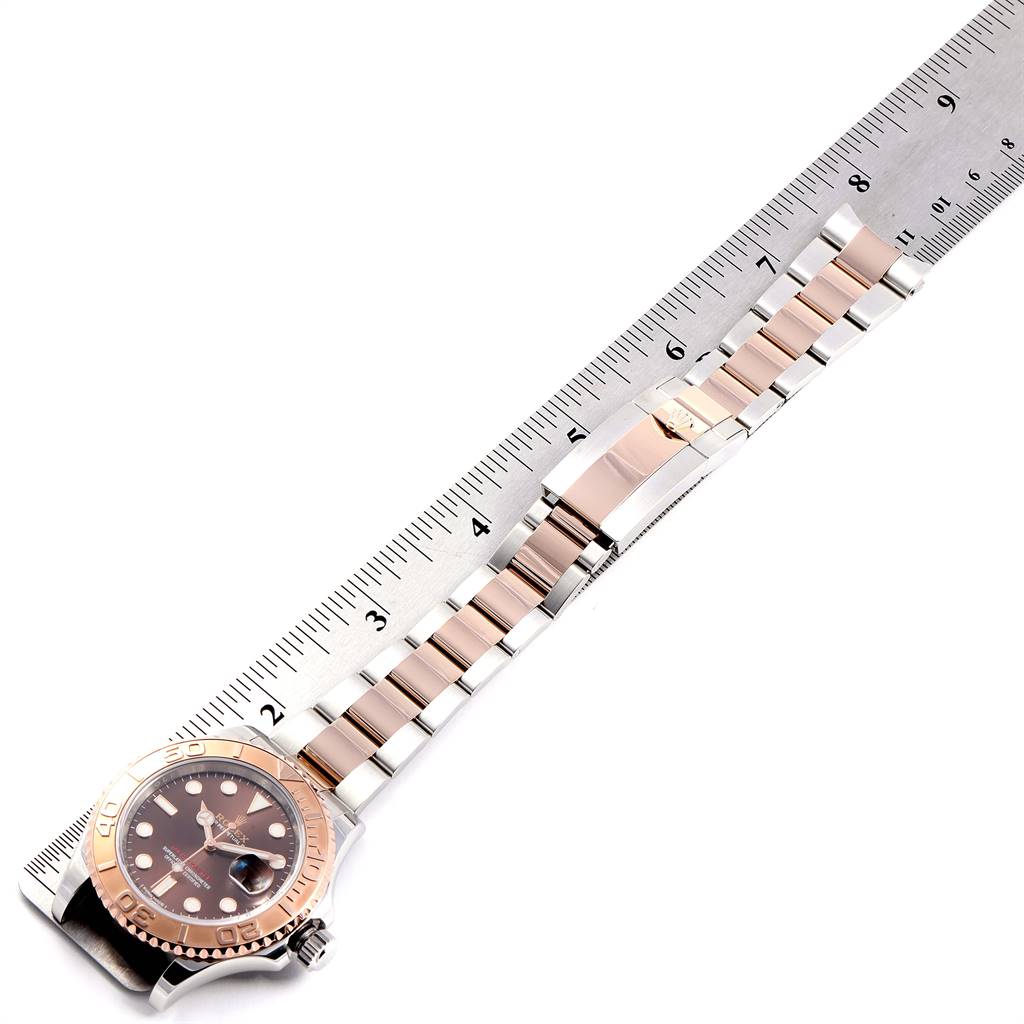The image shows a Rolex Yacht-Master 116621 Men's Stainless Steel Brown Dial 116621 Men's Stainless Steel Brown Dial watch, with a focus on the bezel, dial, and the partially opened bracelet, measured with a ruler.