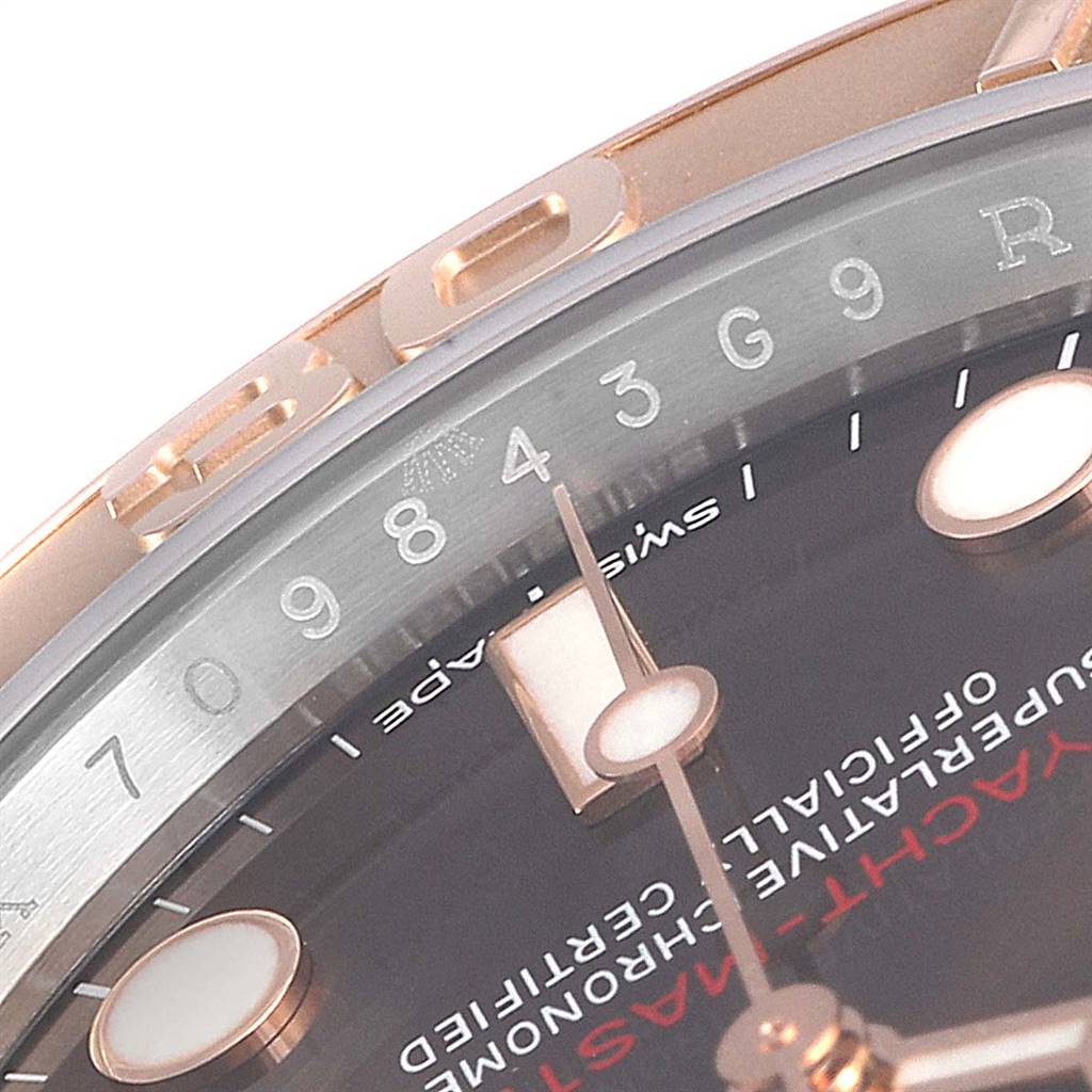 This close-up image of the Rolex Yacht-Master 116621 Men's Stainless Steel Brown Dial 116621 Men's Stainless Steel Brown Dial watch shows part of the bezel, dial, and hour hand.
