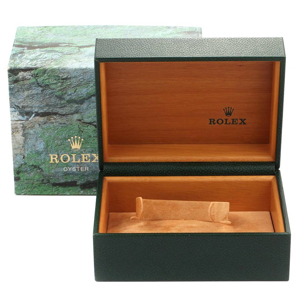 The image shows an open green Rolex box with a wooden interior, designed for the Yacht-Master model.
