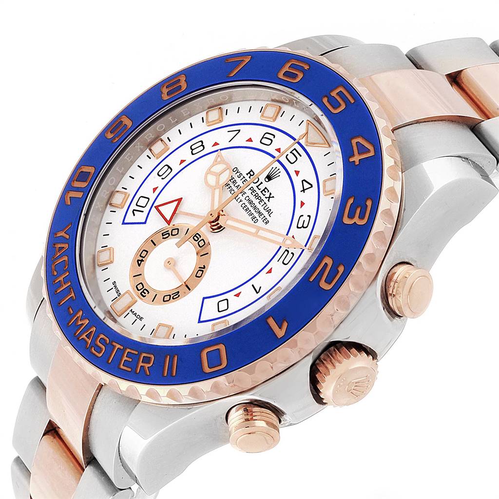 The Rolex Yacht-Master 116681 Men's Steel and Gold (two tone) White Dial 116681 Men's Steel and Gold (two tone) White Dial watch is shown at an angled view, highlighting the blue bezel, dial, and crown.