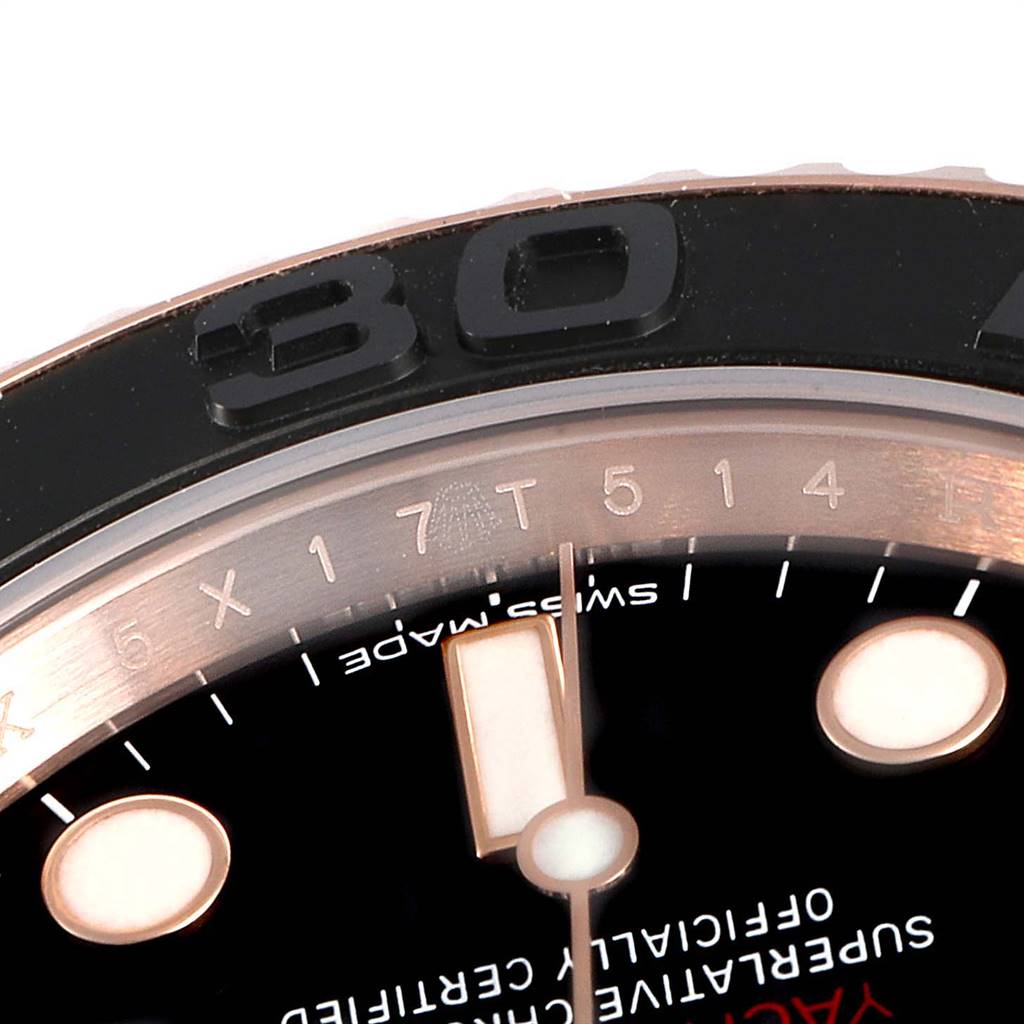 Close-up of the Rolex Yacht-Master 116655 Men's Rose Gold Black Dial 116655 Men's Rose Gold Black Dial watch displaying the bezel and part of the dial with numbers and markings.