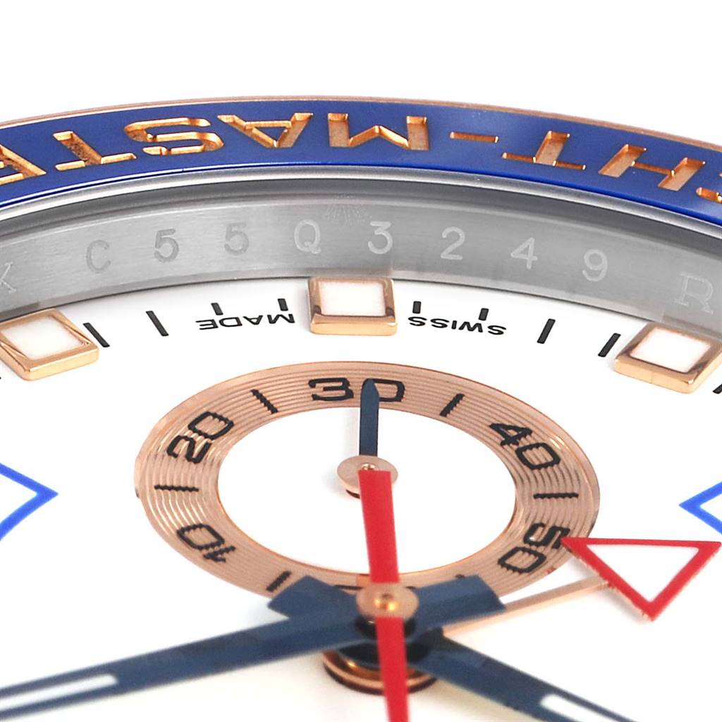 This close-up of the Rolex Yacht-Master 116681 Men's Steel and Gold (two tone) White Dial 116681 Men's Steel and Gold (two tone) White Dial model showcases the dial, hands, and partial bezel.