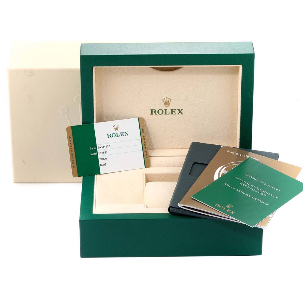 The image shows the packaging of a Rolex Yacht-Master 116622 Men
s Stainless Steel Blue Dial 116622 Men
s Stainless Steel Blue Dial watch, including the box, warranty card, and booklets.