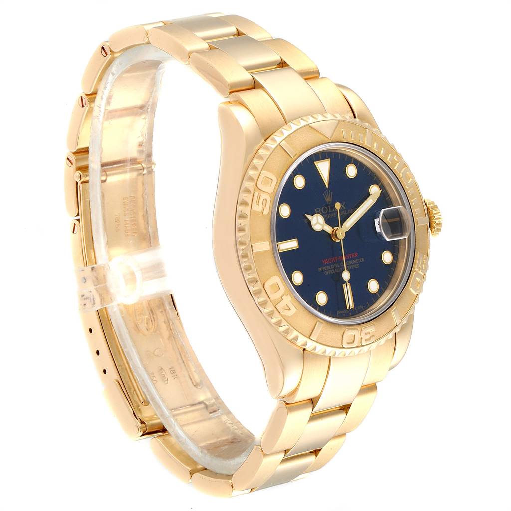 The image shows a side angle of the Rolex Yacht-Master 68628 Yellow Gold Blue Dial 68628 Yellow Gold Blue Dial watch, highlighting the gold bracelet, blue dial, and bezel.