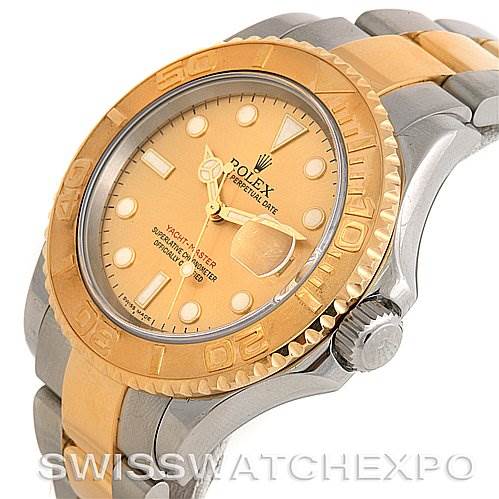 The image shows a close-up of the Rolex Yacht-Master 16623 Men's Stainless Steel Champagne Dial 16623 Men's Stainless Steel Champagne Dial watch, focusing on its dial, bezel, and part of the bracelet at an angled view.