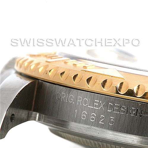 This close-up shows the side view of the Rolex Yacht-Master 16623 Men's Stainless Steel Champagne Dial 16623 Men's Stainless Steel Champagne Dial, featuring the bezel and part of the case with engraved details.