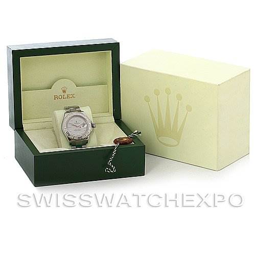 The image shows a Rolex Yacht-Master 16622 Men's Stainless Steel Silver Dial 16622 Men's Stainless Steel Silver Dial watch in its green presentation box, next to its outer packaging.