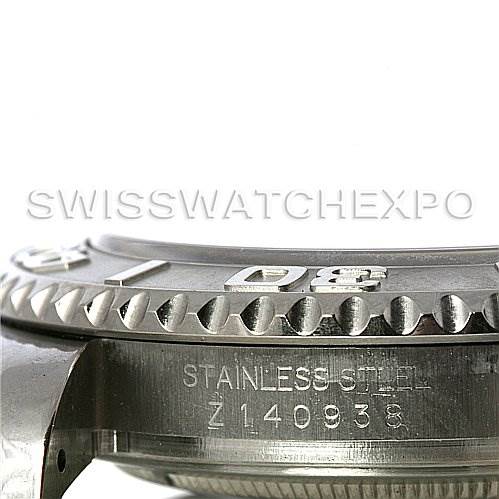 This image shows a side view of the Rolex Yacht-Master 16622 Men's Stainless Steel Silver Dial 16622 Men's Stainless Steel Silver Dial watch, focusing on the bezel and the case with a visible serial number.