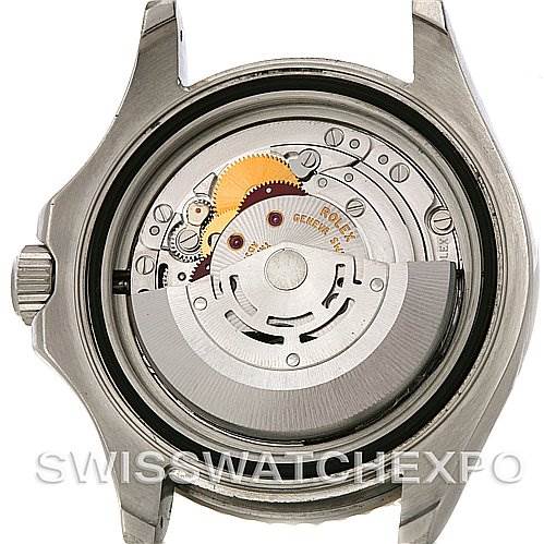 The image shows the open back of a Rolex Yacht-Master 16622 Men's Stainless Steel Silver Dial 16622 Men's Stainless Steel Silver Dial, exposing its intricate movement and internal gears.