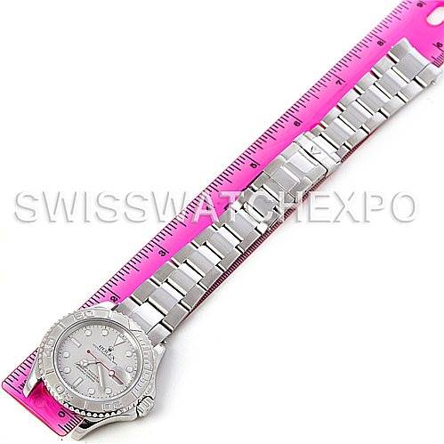 The Rolex Yacht-Master 16622 Men's Stainless Steel Silver Dial 16622 Men's Stainless Steel Silver Dial watch is shown from a top-down angle alongside a pink ruler for scale, displaying the face and bracelet.