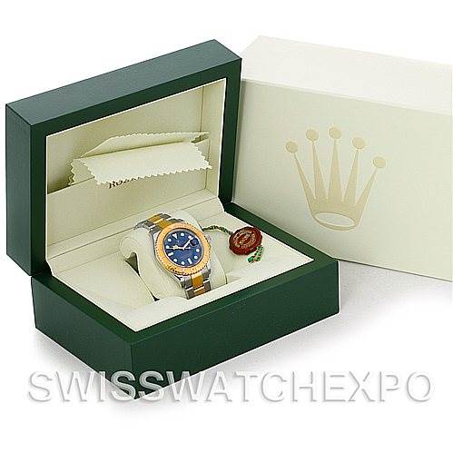 The image shows a Rolex Yacht-Master 16623 Men's Stainless Steel Blue Dial 16623 Men's Stainless Steel Blue Dial watch in a green and white presentation box, viewed at an angle slightly above the front.